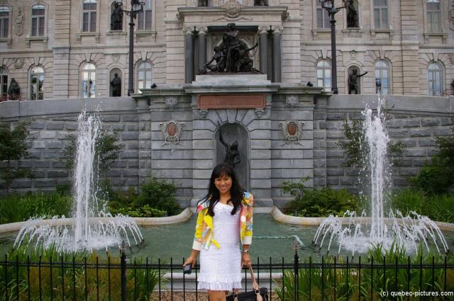 Joann in front of two fountains in front of the Parliament Building in Quebec.jpg
