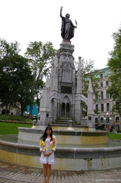 Joann in front of water fontain statue in Old Quebec City.jpg
