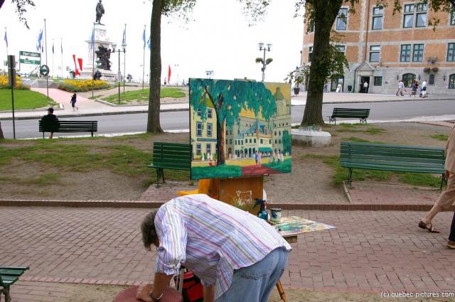 Artist and his painting of area in Old Quebec City.jpg
